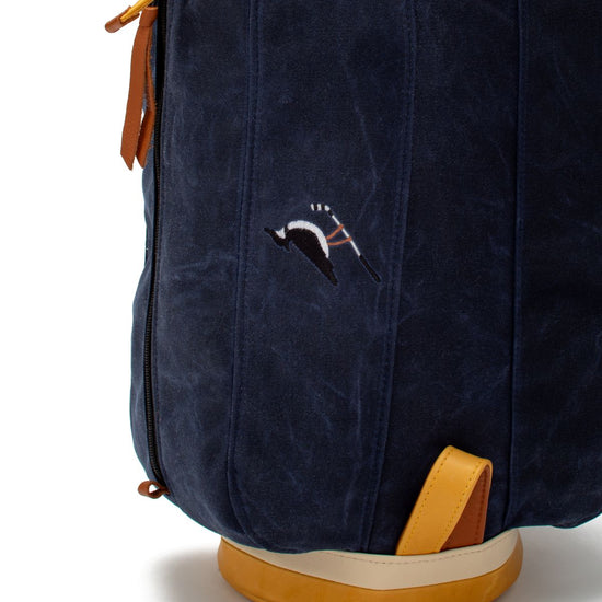 Embroidered logo on the blue Fescue & Dunes MacKenzie Walker golf bag